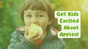 Child happy and eating an apple